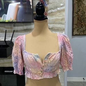 Rainbow colored button down crop top. With ruching in the back. Puff sleeves.